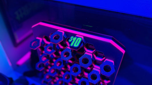 Rhino's Reef 3D-printed frag rack and plugs glowing under UV light